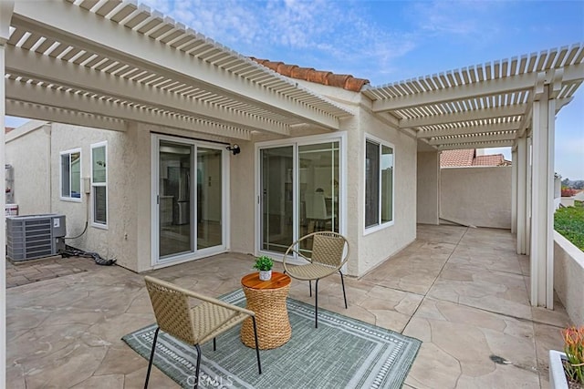 view of patio / terrace with cooling unit and a pergola