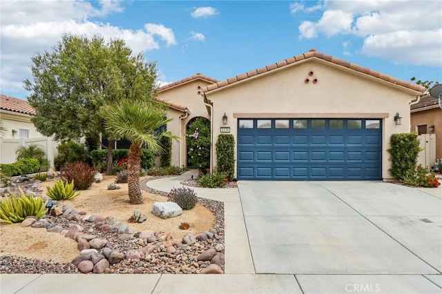 1436 Via Rojas, Hemet, CA 92545 - mediterranean / spanish-style home with driveway, an attached garage, and stucco siding