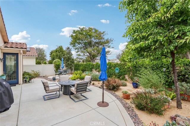 1436 Via Rojas, Hemet, CA 92545 - view of patio with outdoor dining area and fence