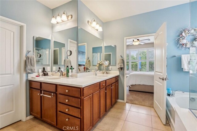 1436 Via Rojas, Hemet, CA 92545 - ensuite bathroom with tile patterned floors, a ceiling fan, double vanity, and a bath