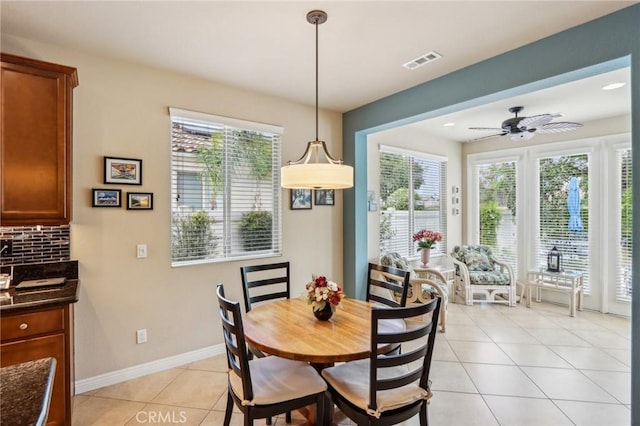 1436 Via Rojas, Hemet, CA 92545 - dining room featuring light tile patterned flooring, healthy amount of natural light, ceiling fan, and baseboards