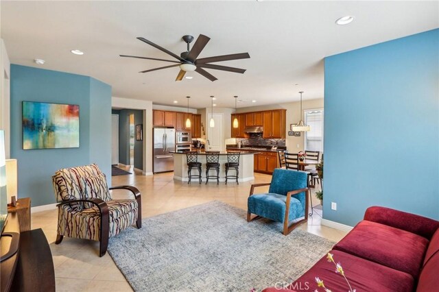 1436 Via Rojas, Hemet, CA 92545 - living room featuring light tile patterned floors, a ceiling fan, recessed lighting, and baseboards