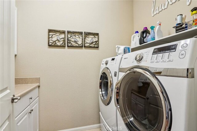 1436 Via Rojas, Hemet, CA 92545 - laundry area with separate washer and dryer, cabinet space, and baseboards