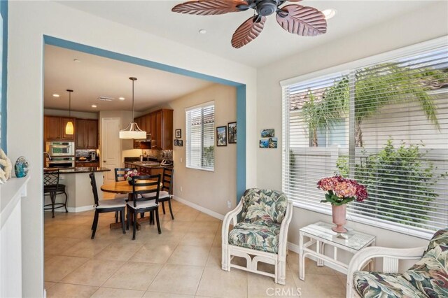 1436 Via Rojas, Hemet, CA 92545 - dining area with ceiling fan, light tile patterned floors, recessed lighting, and baseboards
