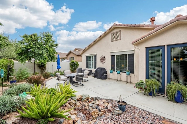 1436 Via Rojas, Hemet, CA 92545 - back of house with fence, a patio area, stucco siding, central air condition unit, and a tile roof