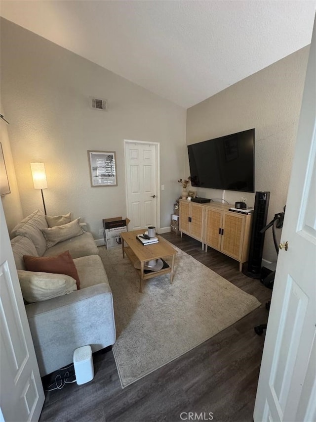 170 Agostino, Irvine, CA 92614 - living room with vaulted ceiling, dark wood-type flooring, and baseboards