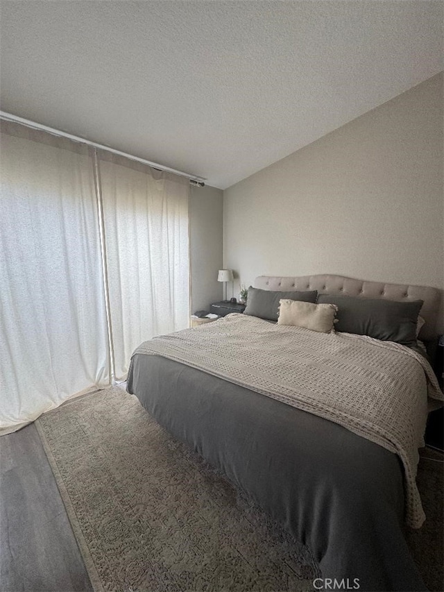 170 Agostino, Irvine, CA 92614 - bedroom with wood finished floors and a textured ceiling