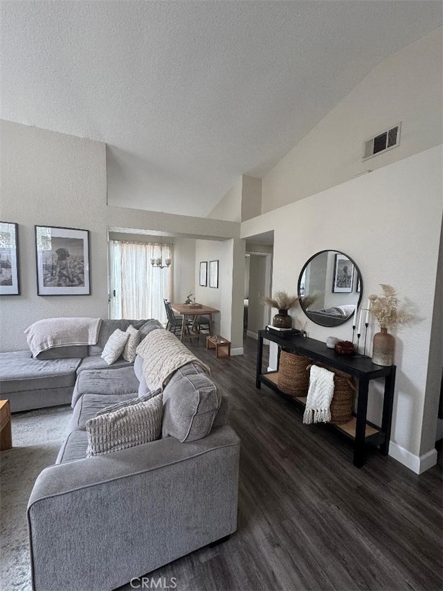 170 Agostino, Irvine, CA 92614 - living area featuring dark wood-style flooring, a chandelier, a textured ceiling, baseboards, and vaulted ceiling