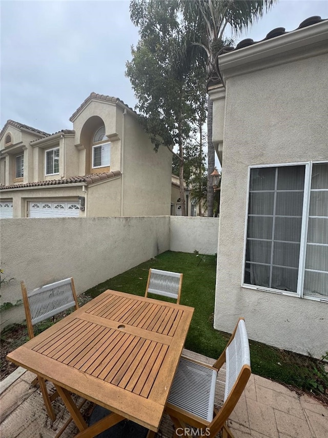 170 Agostino, Irvine, CA 92614 - view of patio / terrace with outdoor dining space and fence