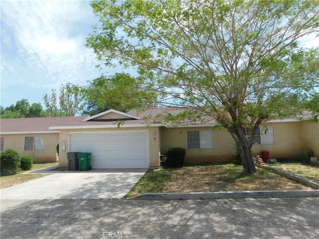 38625 25th St E, Palmdale, CA 93550 - ranch-style house featuring a garage, stucco siding, and concrete driveway