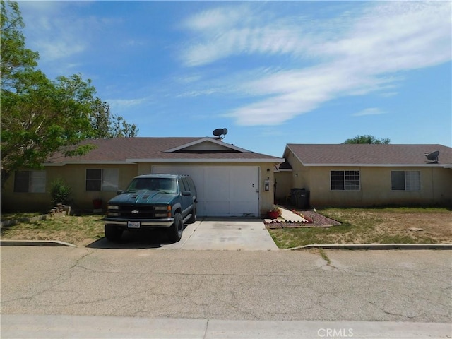 38625 25th St E, Palmdale, CA 93550 - ranch-style home featuring driveway, a garage, and stucco siding