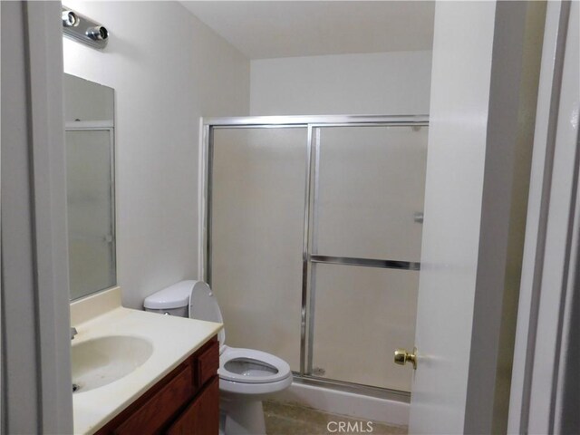 38625 25th St E, Palmdale, CA 93550 - bathroom featuring toilet, a stall shower, and vanity