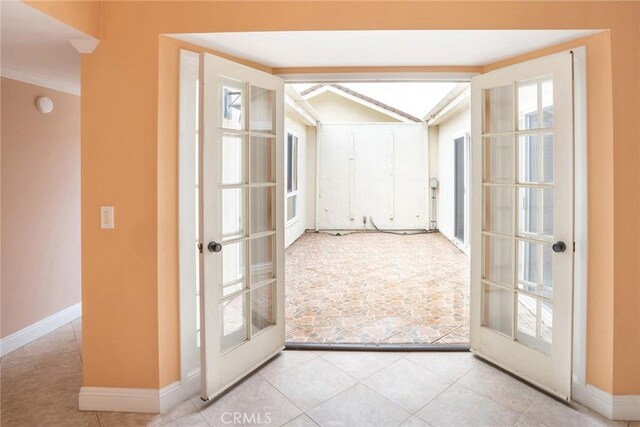 303 Calle Escuela, San Clemente, CA 92672 - doorway to outside with french doors, vaulted ceiling, tile patterned floors, and baseboards