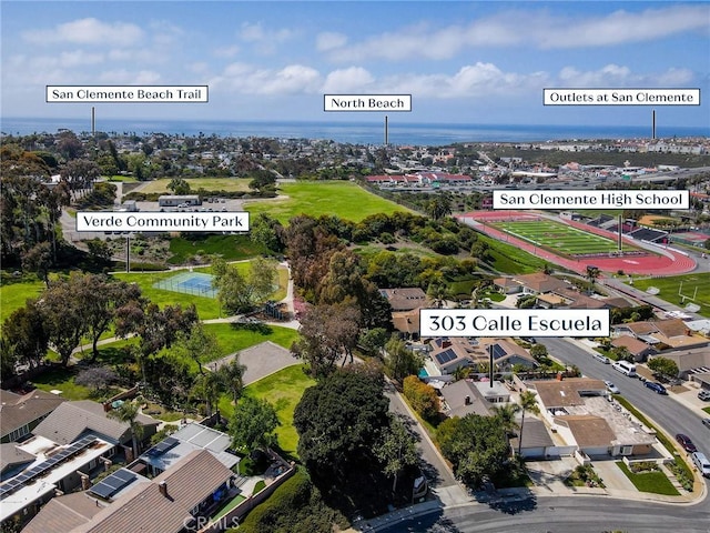 aerial perspective of suburban area with a large body of water