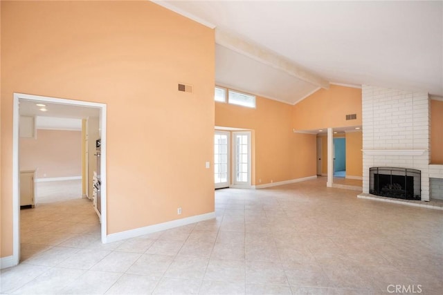 unfurnished living room featuring high vaulted ceiling, beamed ceiling, light tile patterned floors, a fireplace, and baseboards