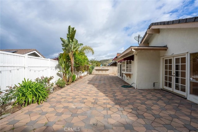 303 Calle Escuela, San Clemente, CA 92672 - view of patio featuring french doors and a fenced backyard