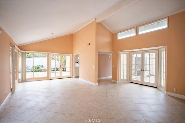 empty room with french doors, high vaulted ceiling, light tile patterned floors, healthy amount of natural light, and crown molding