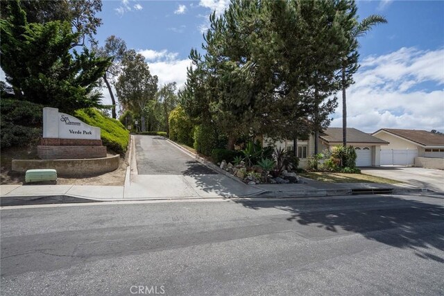 303 Calle Escuela, San Clemente, CA 92672 - view of asphalt road featuring sidewalks and curbs