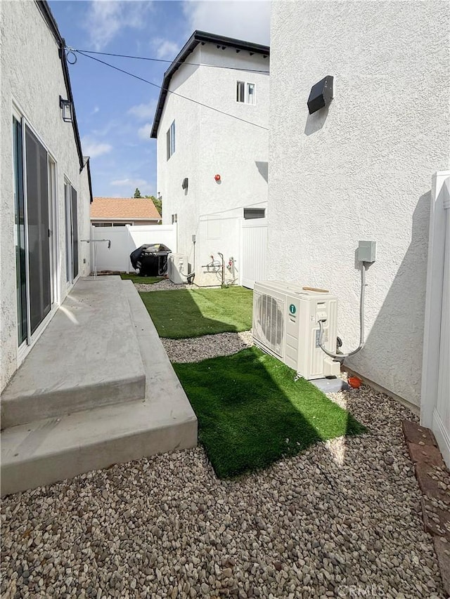 10430 Densmore Ave, Granada Hills, CA 91344 - fenced backyard with ac unit and a patio