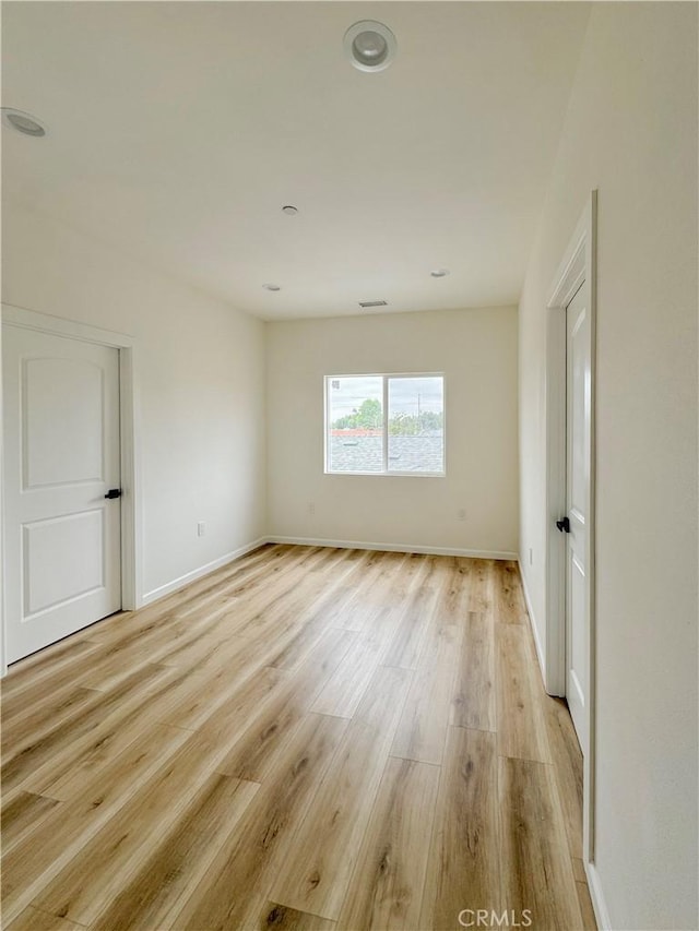10430 Densmore Ave, Granada Hills, CA 91344 - unfurnished room with light wood-type flooring and baseboards