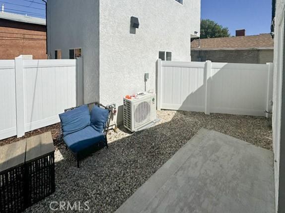 10430 Densmore Ave, Granada Hills, CA 91344 - view of patio / terrace with fence and a cooling unit