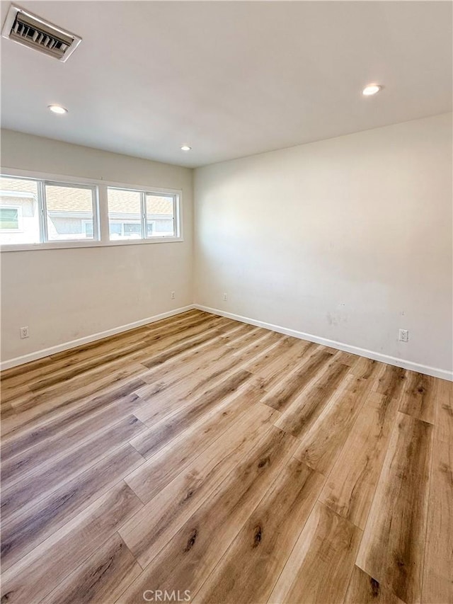 10430 Densmore Ave, Granada Hills, CA 91344 - empty room featuring light wood-style floors, recessed lighting, and baseboards