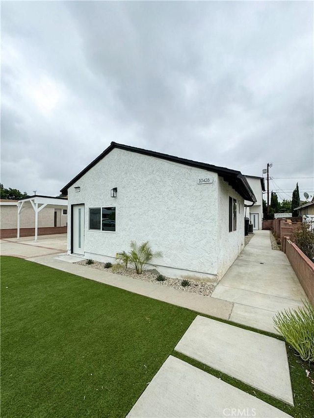 10430 Densmore Ave, Granada Hills, CA 91344 - view of side of property featuring stucco siding