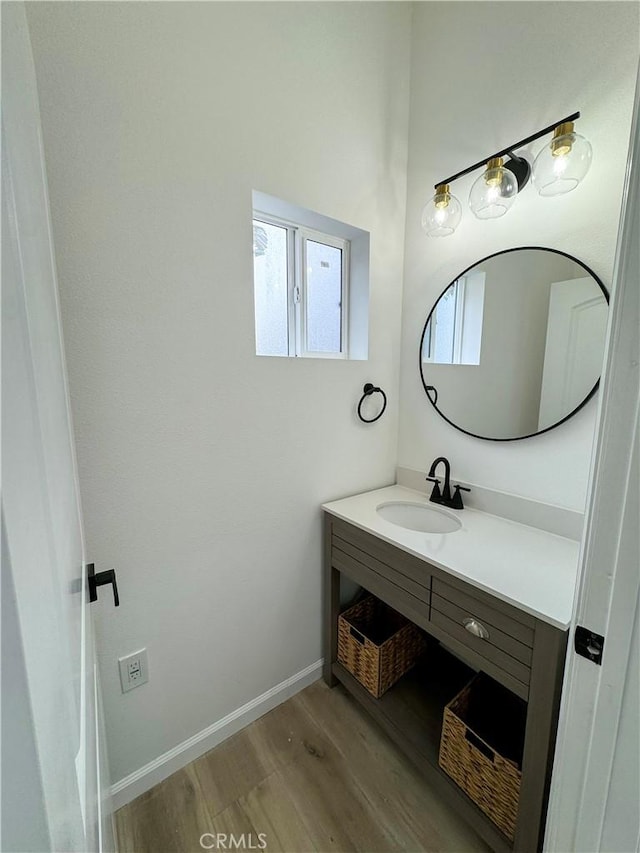 10430 Densmore Ave, Granada Hills, CA 91344 - bathroom with wood finished floors, vanity, and baseboards