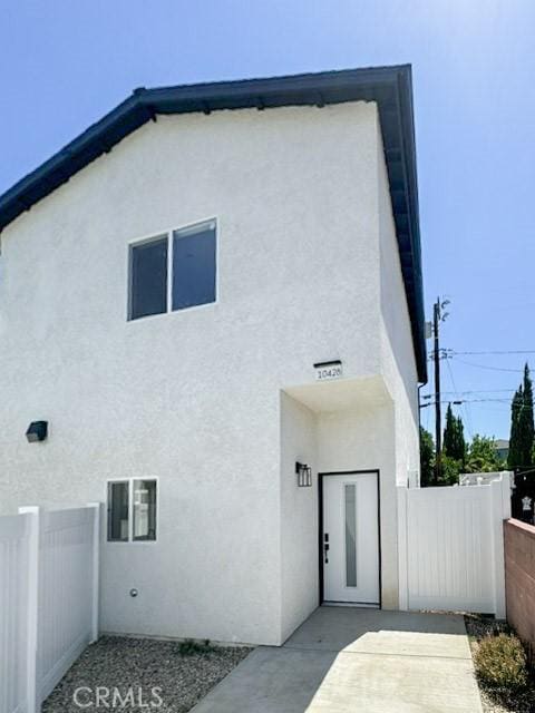 10430 Densmore Ave, Granada Hills, CA 91344 - back of property featuring stucco siding and fence