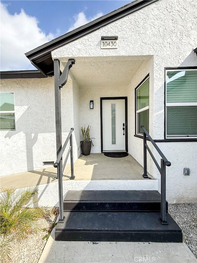 10430 Densmore Ave, Granada Hills, CA 91344 - doorway to property with stucco siding