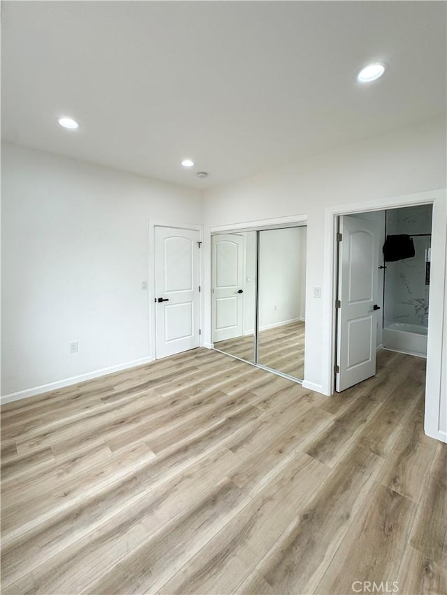 10430 Densmore Ave, Granada Hills, CA 91344 - unfurnished bedroom featuring light wood-style flooring, baseboards, recessed lighting, and a closet