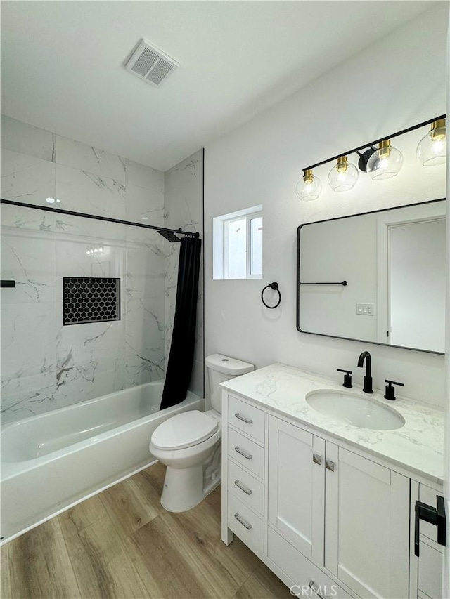 10430 Densmore Ave, Granada Hills, CA 91344 - bathroom featuring wood finished floors, toilet, shower / bath combo, and vanity