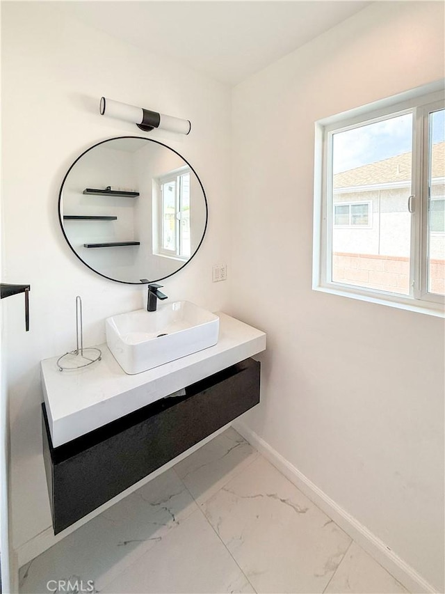 10430 Densmore Ave, Granada Hills, CA 91344 - bathroom featuring marble finish flooring, baseboards, and healthy amount of natural light