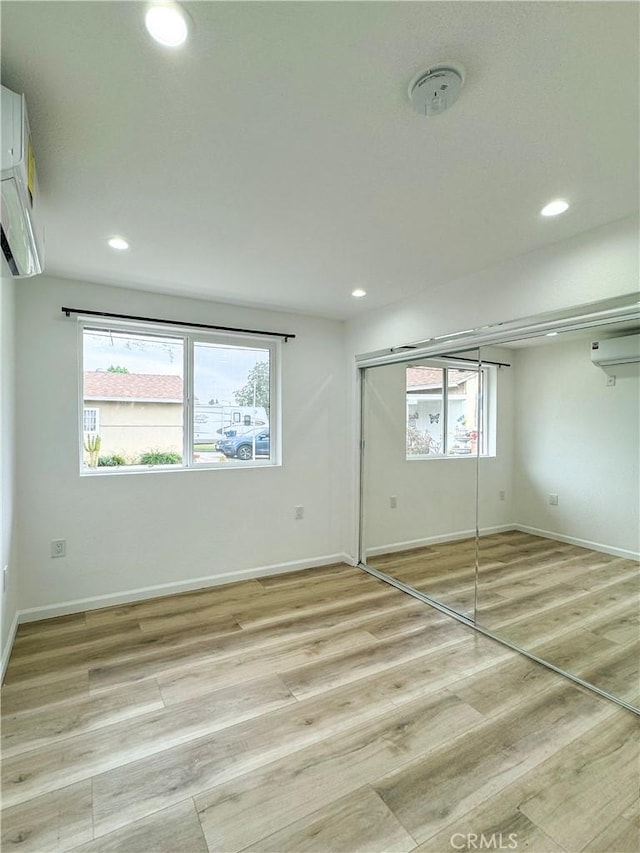 10430 Densmore Ave, Granada Hills, CA 91344 - unfurnished bedroom featuring light wood finished floors, baseboards, multiple windows, and recessed lighting