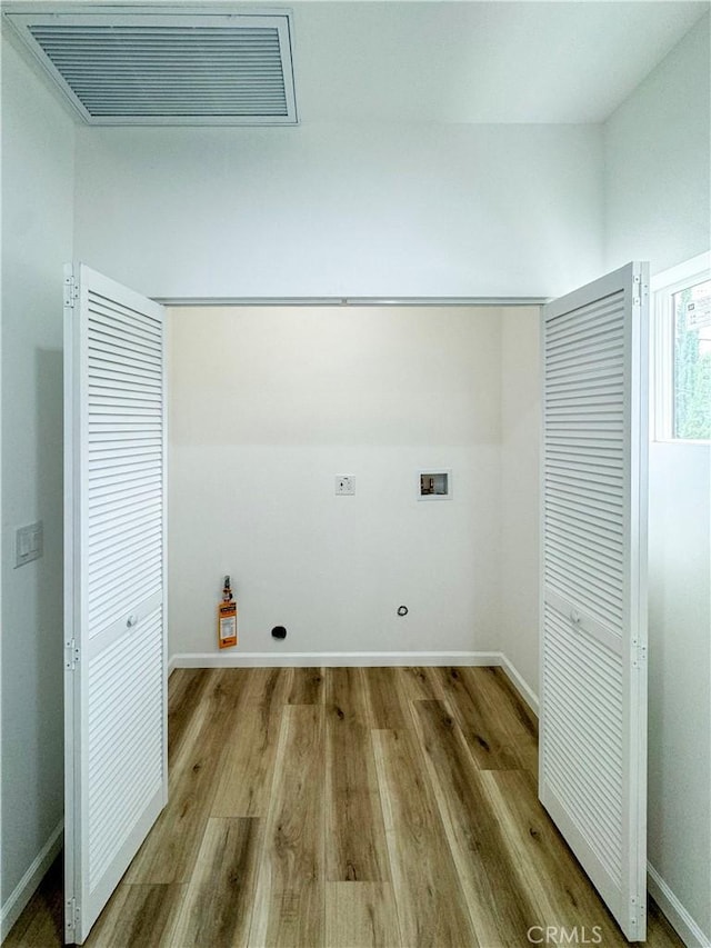 10430 Densmore Ave, Granada Hills, CA 91344 - washroom with hookup for a washing machine, wood finished floors, baseboards, and hookup for an electric dryer