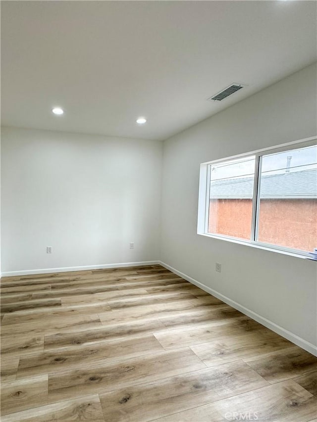 10430 Densmore Ave, Granada Hills, CA 91344 - unfurnished room with light wood-style floors, recessed lighting, and baseboards