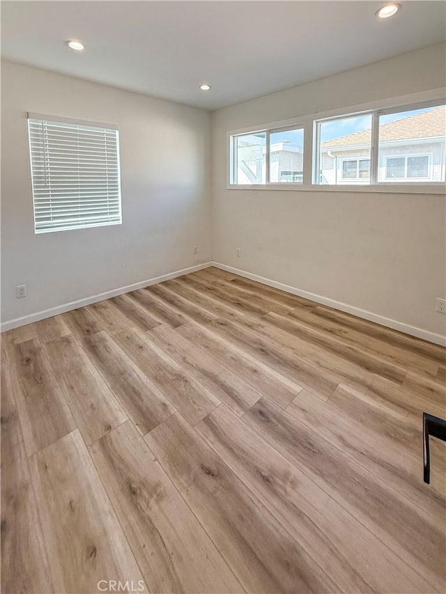 10430 Densmore Ave, Granada Hills, CA 91344 - empty room with light wood-style floors, recessed lighting, and baseboards