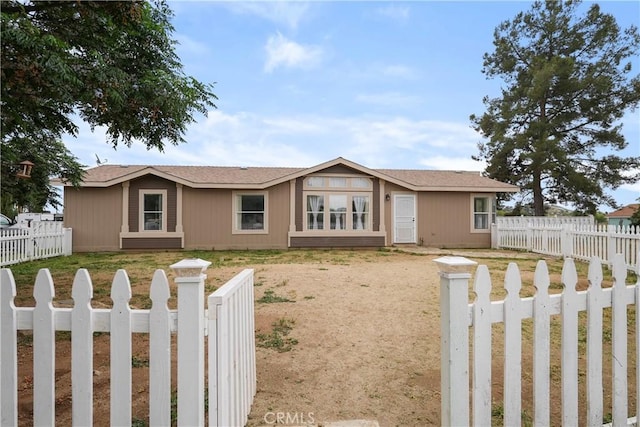 view of front of house featuring a fenced backyard