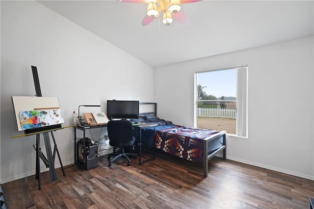 bedroom with wood finished floors, lofted ceiling, baseboards, and a ceiling fan