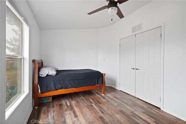 bedroom with wood finished floors, ceiling fan, and baseboards