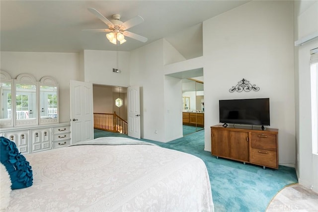 21714 Agajanian Ln, Saugus, CA 91350 - carpeted bedroom with high vaulted ceiling, ensuite bathroom, baseboards, and a ceiling fan
