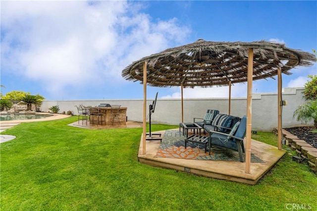 view of green lawn featuring a patio area and outdoor lounge area