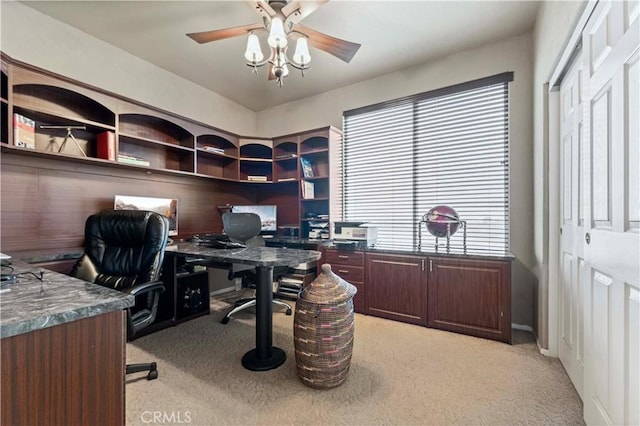 office space featuring light colored carpet and a ceiling fan