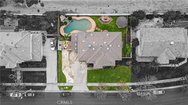 aerial view of property and surrounding area featuring property parcel outlined and a pool