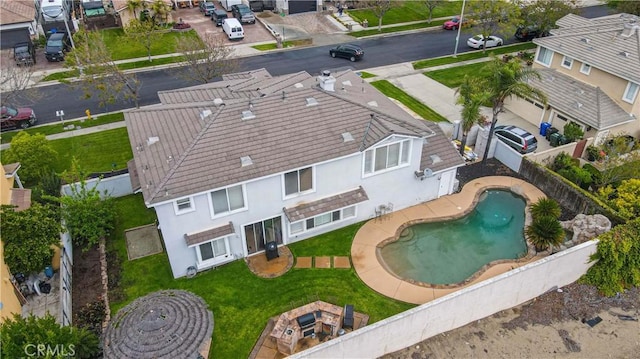 aerial perspective of suburban area featuring a pool area