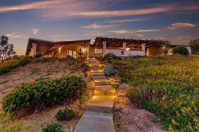 37895 Avenida Bravura, Temecula, CA 92592 - adobe home with stairs, a pergola, and stucco siding