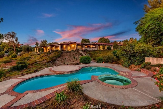 37895 Avenida Bravura, Temecula, CA 92592 - pool at dusk featuring a pool with connected hot tub