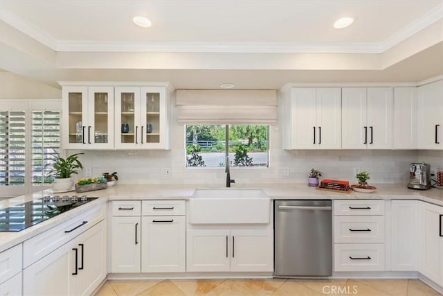 37895 Avenida Bravura, Temecula, CA 92592 - kitchen with stainless steel dishwasher, black electric cooktop, white cabinetry, decorative backsplash, and crown molding