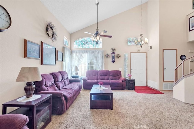 15199 Farmington Ct, Hesperia, CA 92345 - carpeted living area featuring high vaulted ceiling, a ceiling fan, a chandelier, baseboards, and stairs