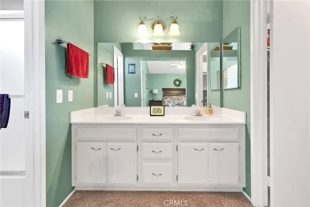 15199 Farmington Ct, Hesperia, CA 92345 - ensuite bathroom featuring double vanity and baseboards